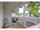 Cozy front porch with gray Adirondack chair and view of a quiet neighborhood street at 144 Jupiter Ln, Summerville, SC 29483