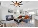 Open-concept living room with hardwood floors, neutral decor, and a view of the dining area at 144 Jupiter Ln, Summerville, SC 29483