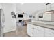 Open living spaces including a well-equipped kitchen and a living room with fireplace and tv at 144 Jupiter Ln, Summerville, SC 29483