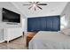 Modern main bedroom with mounted TV, stylish wall, and wood-look floors at 144 Jupiter Ln, Summerville, SC 29483