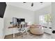 Bright office space with large windows, a beanbag chair, desk and modern decor create a functional workspace at 144 Jupiter Ln, Summerville, SC 29483