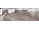 Bright living room with wood floors, recessed lighting, and an open floor plan connected to the kitchen at 145 Threaded Fern St, Summerville, SC 29485