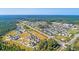 New neighborhood aerial shot featuring beautiful homes and the community surrounded by lush green trees at 147 Threaded Fern St, Summerville, SC 29485