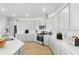 Modern kitchen with stainless steel appliances, sleek countertops, ample storage, and light-gray cabinets at 147 Threaded Fern St, Summerville, SC 29485