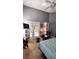 Comfortable bedroom with tall ceilings, a TV and french doors for lots of light at 148 Jupiter Ln, Summerville, SC 29483