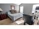Cozy bedroom featuring a queen-sized bed, soft natural light, and neutral gray wall color at 148 Jupiter Ln, Summerville, SC 29483