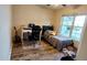 Cozy bedroom with wood-look flooring, a comfortable bed, and natural light from a large window at 148 Jupiter Ln, Summerville, SC 29483