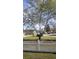 A picturesque front yard framed by a charming white picket fence and mature trees at 148 Jupiter Ln, Summerville, SC 29483