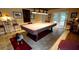 Spacious game room with a covered pool table, seating, and access to the backyard at 148 Jupiter Ln, Summerville, SC 29483
