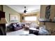 Cozy living room featuring natural light, a ceiling fan, and traditional decor at 148 Jupiter Ln, Summerville, SC 29483