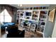 Stylish office with custom built-in shelves, a desk area, and comfortable seating at 148 Jupiter Ln, Summerville, SC 29483