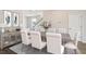 Elegant dining room featuring a large table, tufted chairs, and stylish decor at 151 Threaded Fern St, Summerville, SC 29485