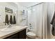 Cozy bathroom features a shower-tub combo and dark cabinets for contrast at 161 Brittondale Rd, Summerville, SC 29485