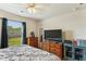 This bedroom features a ceiling fan, a window with natural light, and dresser for storage at 161 Brittondale Rd, Summerville, SC 29485