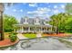 Inviting clubhouse with well-manicured landscaping, towering palm trees, and ample parking; community gathering at its finest at 161 Brittondale Rd, Summerville, SC 29485
