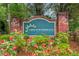 Welcome to Lakes of Summerville: a beautiful entrance sign surrounded by colorful flowers and brick columns at 161 Brittondale Rd, Summerville, SC 29485