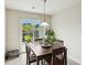 Cozy dining area with a sliding door that opens to the back patio and yard at 161 Brittondale Rd, Summerville, SC 29485