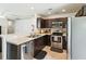 Modern kitchen with stainless steel appliances and dark cabinetry at 161 Brittondale Rd, Summerville, SC 29485