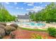 Community pool featuring lounge chairs and tables beside the refreshing pool with nearby clubhouse at 161 Brittondale Rd, Summerville, SC 29485