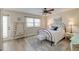 Bedroom with a ceiling fan, dresser, light-colored walls and an exit door at 165 River Breeze Dr, Charleston, SC 29407