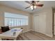 Inviting bedroom featuring a ceiling fan, desk, chair, and natural light at 165 River Breeze Dr, Charleston, SC 29407
