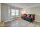 Bright bedroom featuring a comfortable daybed with decorative pillows and a large window at 165 River Breeze Dr, Charleston, SC 29407