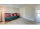 Cozy bedroom with a daybed, stylish pillows, wood floors, and closet at 165 River Breeze Dr, Charleston, SC 29407