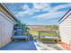 Scenic deck view with seating overlooking green wetlands at 165 River Breeze Dr, Charleston, SC 29407