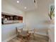 Dining room with a glass table, four chairs, and a view through to the kitchen at 165 River Breeze Dr, Charleston, SC 29407