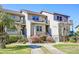 Attractive townhouse-style condos with well-manicured lawns and landscaped gardens with blooming flowers at 165 River Breeze Dr, Charleston, SC 29407