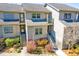 Charming townhouse featuring well-manicured landscaping and inviting front entrances at 165 River Breeze Dr, Charleston, SC 29407