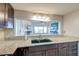 Open kitchen view overlooking the living room, showcasing granite counters and modern finishes at 165 River Breeze Dr, Charleston, SC 29407