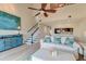 Bright living room featuring high ceilings, white sofa with accent pillows, and a view of the kitchen at 165 River Breeze Dr, Charleston, SC 29407
