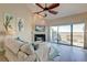 Bright and airy living room with vaulted ceilings, fireplace, and marsh views, perfect for relaxing at 165 River Breeze Dr, Charleston, SC 29407