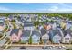 An aerial view showcases a neighborhood with colorful homes and manicured lawns at 1656 Indy Dr, North Charleston, SC 29405