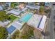 An aerial perspective of a swimming pool area surrounded by lounging spots and greenery at 1656 Indy Dr, North Charleston, SC 29405