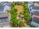 An aerial view looking down at a landscaped common area surrounded by colorful homes at 1656 Indy Dr, North Charleston, SC 29405