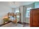 Bedroom with a bunk bed, hardwood floors, and two windows that illuminate the room at 1656 Indy Dr, North Charleston, SC 29405