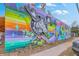 Eye-catching wall mural featuring a moose and abstract patterns against a blue sky backdrop at 1656 Indy Dr, North Charleston, SC 29405