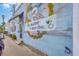 A colorful mural displays a motivational message, 'Be excellent to each other,' with artistic details at 1656 Indy Dr, North Charleston, SC 29405