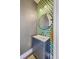 Stylish powder room with modern fixtures, unique wallpaper, and elegant design at 1656 Indy Dr, North Charleston, SC 29405