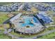 Aerial view showcasing the community pool, clubhouse, and surrounding homes at 184 Clearblue Loop, Summerville, SC 29486