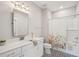Stylish bathroom boasts black and white patterned tile floor, and shower-tub with floral curtain at 184 Clearblue Loop, Summerville, SC 29486