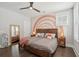 Cozy bedroom showcases two twin beds with a unique rainbow wall design at 184 Clearblue Loop, Summerville, SC 29486