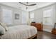 Bright bedroom features hardwood floors, neutral walls, and a surfboard for coastal living at 184 Clearblue Loop, Summerville, SC 29486