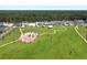Aerial view of a community park with a playground, walking paths, and expansive green space at 184 Clearblue Loop, Summerville, SC 29486