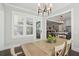 View of a casual dining area leading to a modern kitchen and living space at 184 Clearblue Loop, Summerville, SC 29486