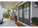 Welcoming front porch featuring double doors, comfortable seating, and stylish decor for relaxing outdoors at 184 Clearblue Loop, Summerville, SC 29486
