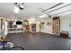 Garage interior featuring sauna, well-organized storage shelving, a mounted television, and three ceiling fans at 184 Clearblue Loop, Summerville, SC 29486
