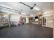 Spacious garage interior with installed sauna, ceiling fans, ample storage shelving, and modern lighting at 184 Clearblue Loop, Summerville, SC 29486
